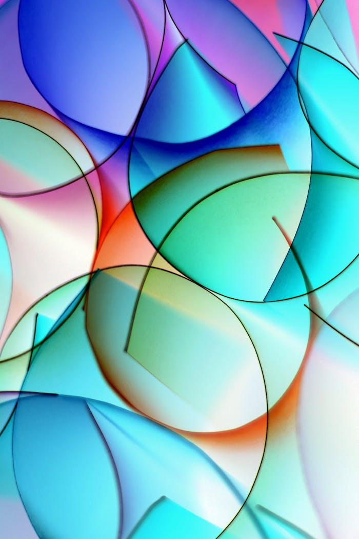A vibrant abstract artwork featuring colorful overlapping geometric shapes.